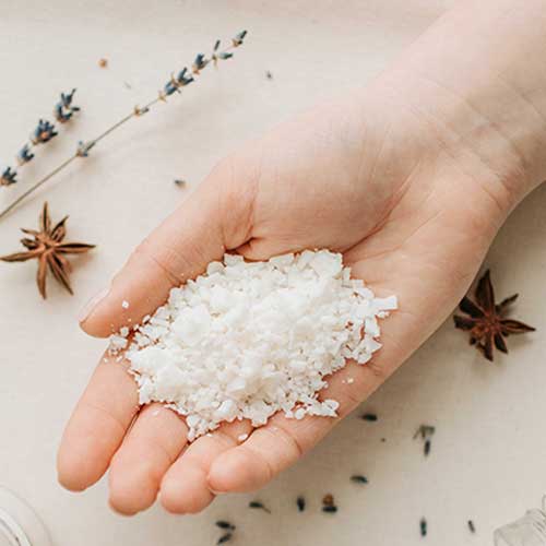 Photo by Vlada Karpovich: https://www.pexels.com/photo/top-view-of-woman-holding-a-handful-of-granulated-wax-over-handmade-candles-6755753/ paraffin wax